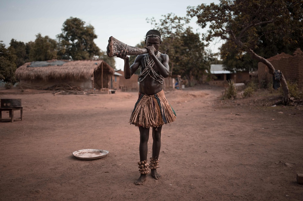 A young Broto traditional musician trains to play the wooden horn in Bambari, in the centre of Central African Republic March 14, 2019. u00e2u20acu201d AFP pic