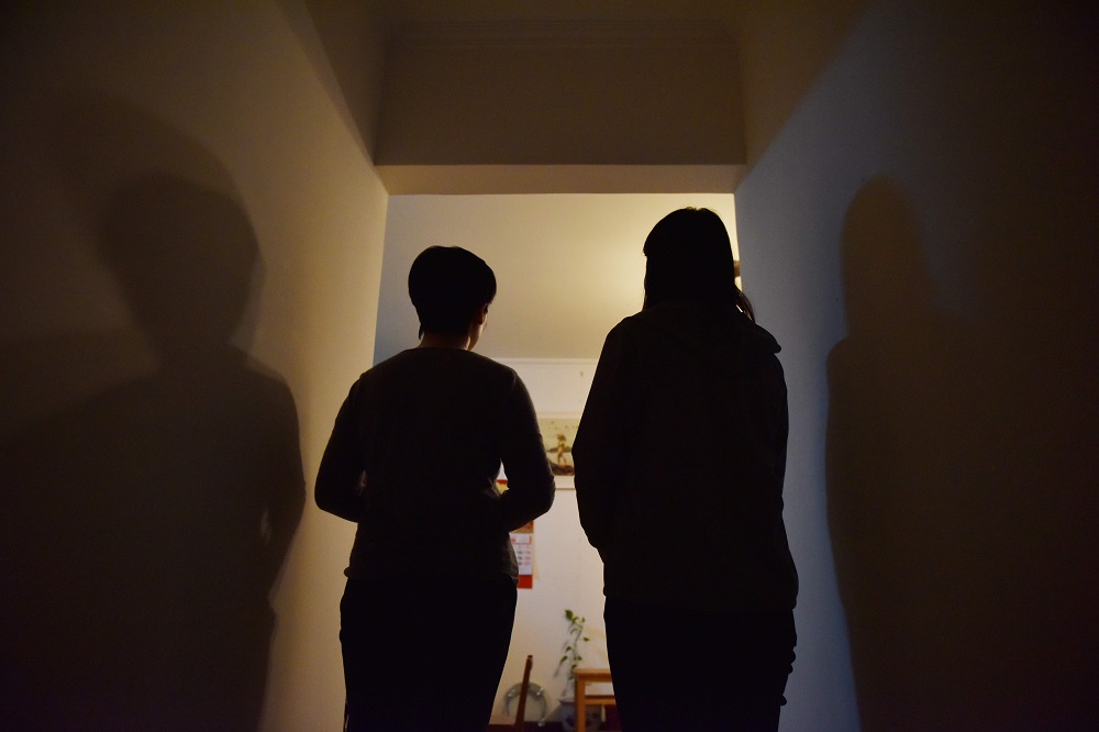 This photo taken on April 5, 2019 shows two Falungong practitioners posing for a photo after an interview in an apartment in Beijing. u00e2u20acu201d AFP pic     