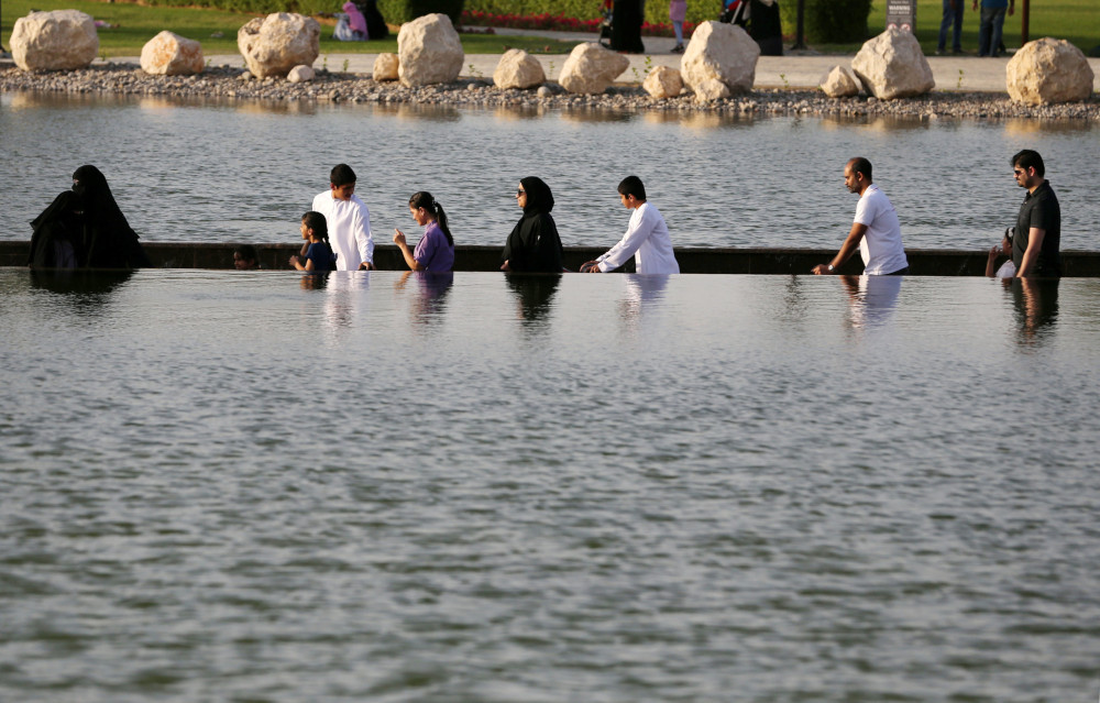 Visitors are seen crossing the lake at Dubaiu00e2u20acu2122s Quranic Park in Dubai, UAE April 6, 2019. u00e2u20acu201d Reuters pic 