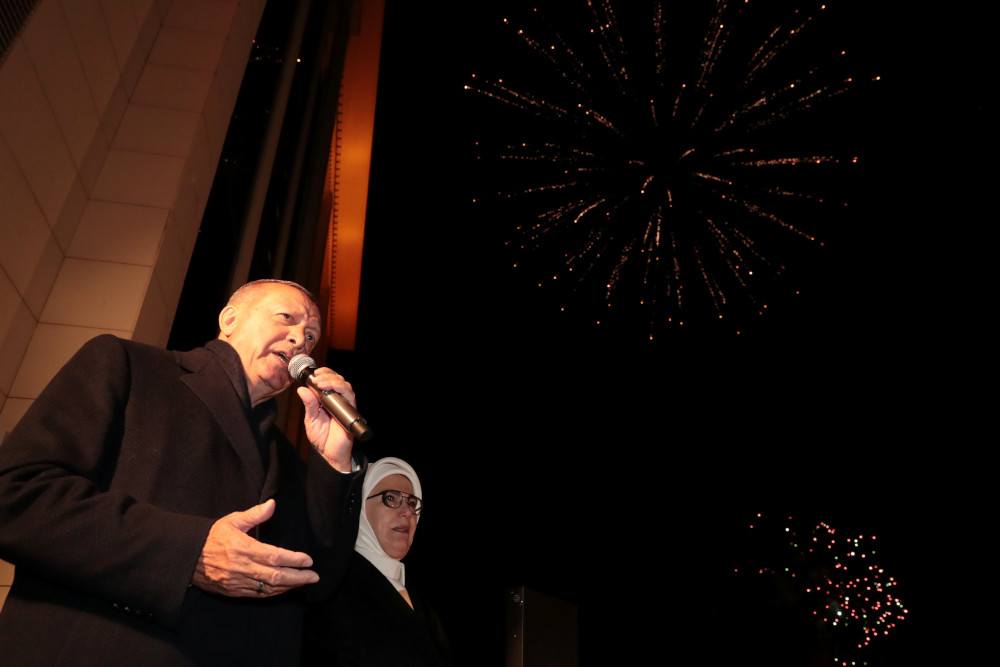 Turkish President Tayyip Erdogan, accompanied by his wife Emine Erdogan, addresses AK Party supporters in Ankara, Turkey April 1, 2019. u00e2u20acu201d Murat Cetinmuhurdar/Presidential Press Office handout pic via Reuters 
