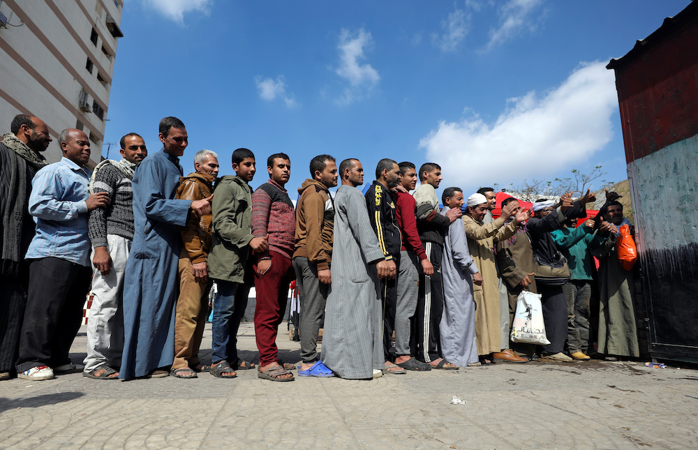 People stand in line to cast their vote during the referendum on draft constitutional amendments, at a polling station in Cairo, Egypt April 20, 2019. u00e2u20acu201d Reuters pic