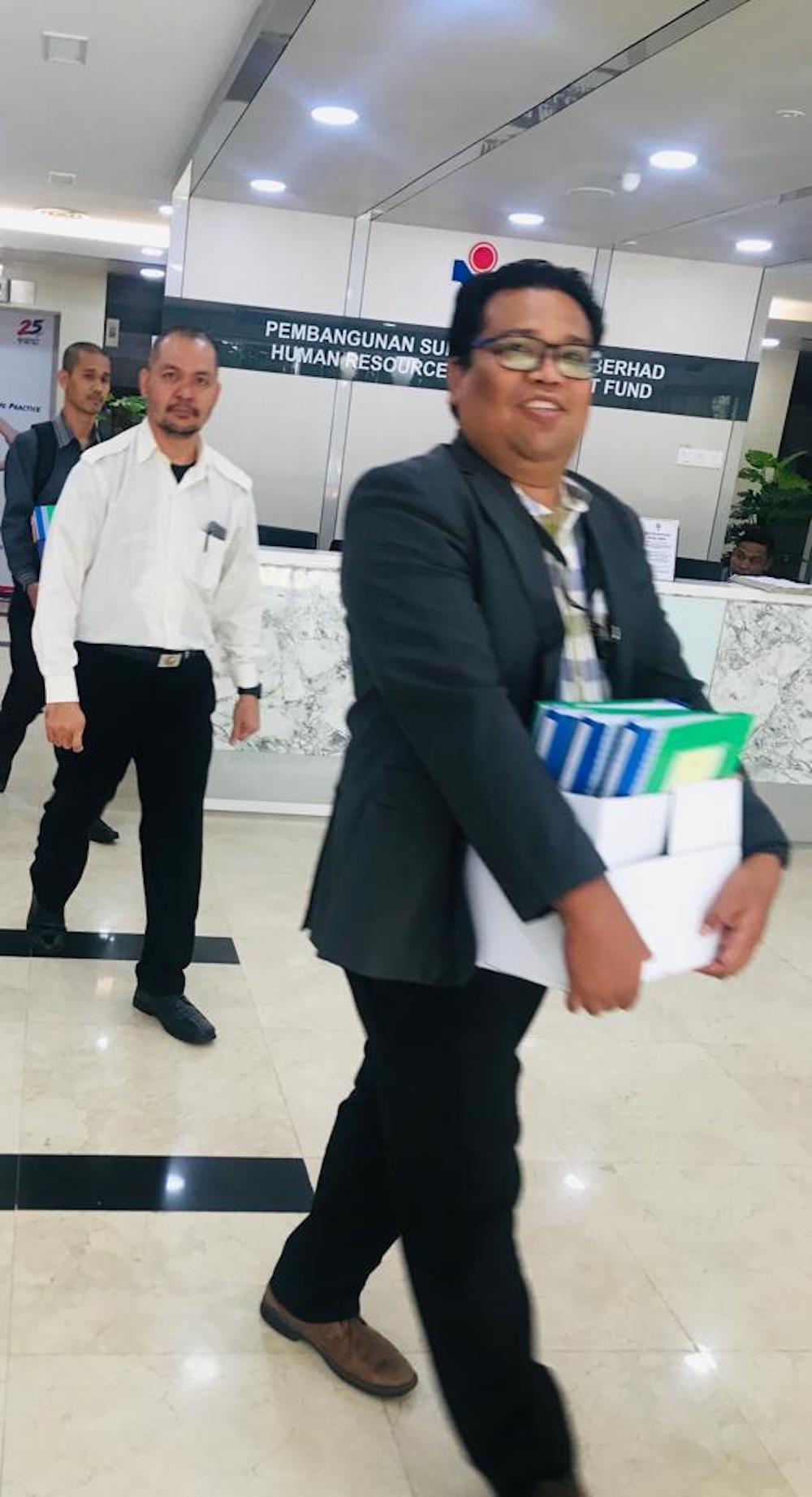 MACC officers spotted removing several boxes of files from the HRDF office in Damansara Heights, Kuala Lumpur starting Monday, April 2, 2019.