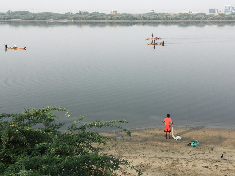 A fisherman prepares to cast his net in Ennore Creek, which has seen rapid industrial development after coastal zone laws were diluted in the southeastern city of Chennai, India March 16, 2019. u00e2u20acu201d Thomson Reuters Foundation pic