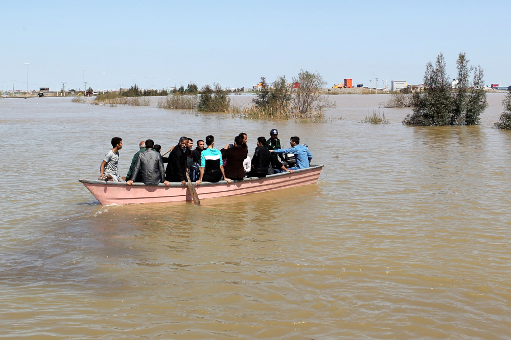 People are seen on a boat after a flooding in Golestan province, Iran, March 24, 2019. u00e2u20acu201d Tasnim News Agency pic via Reuters 