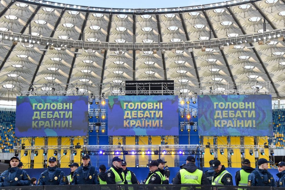 Police officers stand guard inside Kievu00e2u20acu2122s Olympic Stadium, April 19, 2019, before a debate between the two presidential candidates u00e2u20acu201c President Petro Porosheko and his rival, comedian Volodymyr Zelensky. u00e2u20acu201d AFP pic