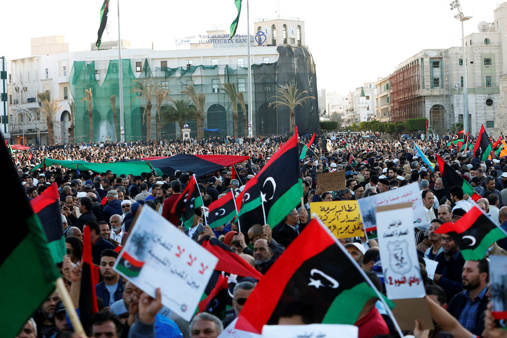 Libyan protesters attend a demonstration to demand an end to the Khalifa Haftaru00e2u20acu2122s offensive against Tripoli, in Martyrs Square in central Tripoli, LibyaApril 12, 2019. u00e2u20acu201d Reuters pic