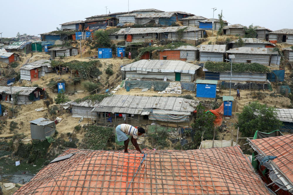 A Rohingya refugee repairs the roof of his shelter at the Balukhali refugee camp in Coxu00e2u20acu2122s Bazar, Bangladesh, March 5, 2019. u00e2u20acu201d Reuters pic 