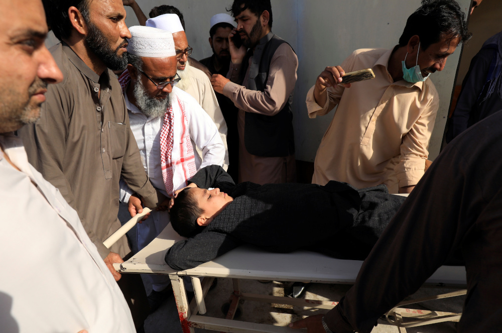 People move a child on stretcher after what they say was a defective vaccine administered outside a hospital in Peshawar, Pakistan April 22, 2019. u00e2u20acu201d Reuters pic 