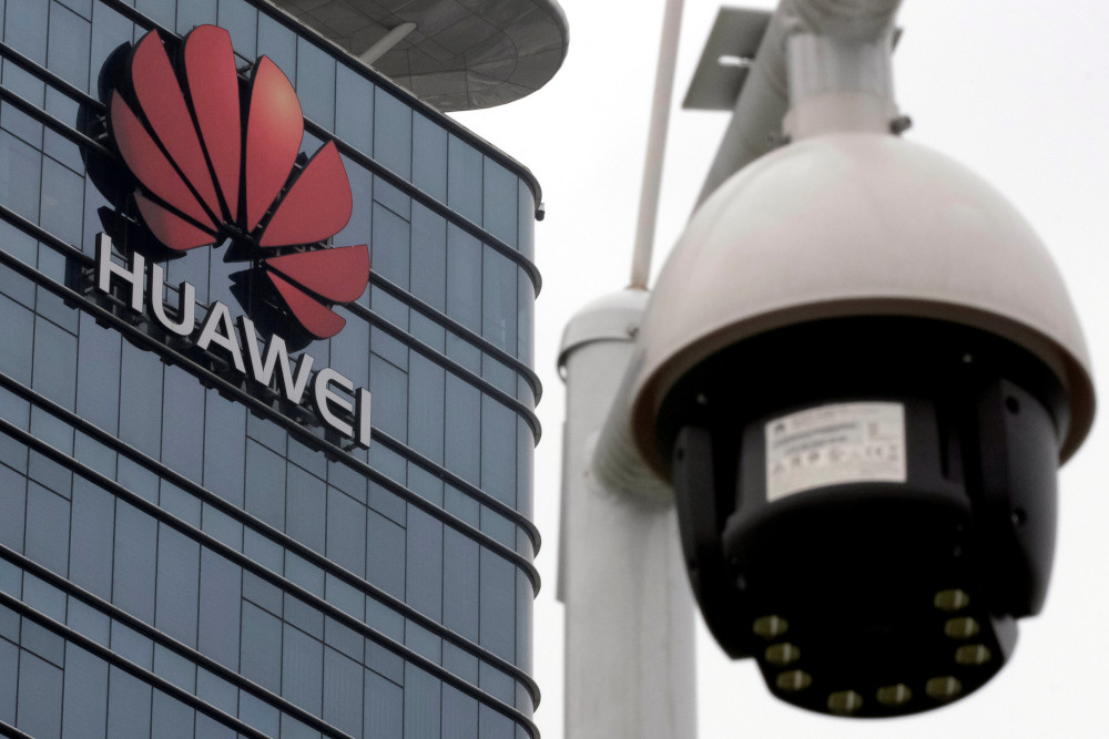A surveillance camera is seen in front of the Huawei logo outside its factory campus in Dongguan, Guangdong province, China, March 25, 2019. u00e2u20acu201d Reuters pic