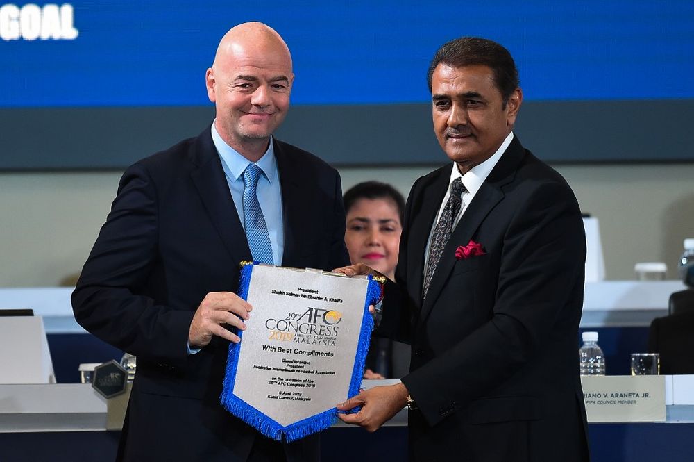 Fifa president Gianni Infantino receives a pennant from AFC senior vice president Praful Patel during the Asian Football Confederation (AFC) Congress 2019 in Kuala Lumpur on April 6, 2019. u00e2u20acu201d AFP pic