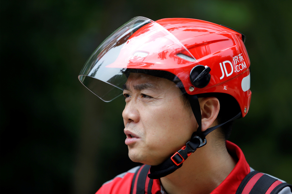 Richard Liu, CEO and founder of Chinau00e2u20acu2122s e-commerce company JD.com, speaks during an interview with Reuters after delivering goods for customers to celebrate the anniversary of the founding of the company, in Beijing, China June 16, 2014. u00e2u20acu201d Reuters pic
