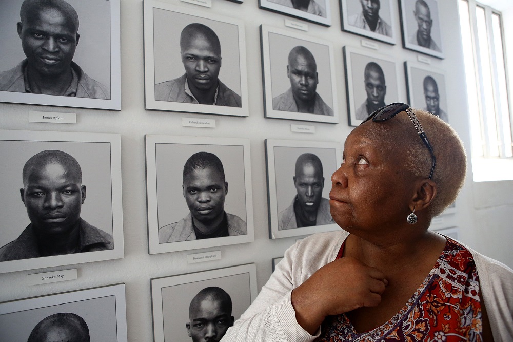 In this file photo taken on August 15, 2018, Pulane Koboekae looks at a picture of her older brother Richard Motsoahae during a tour of the gallows at Kgosi Mampuru Correctional Facility in Pretoria, South Africa. u00e2u20acu201d AFP pic 