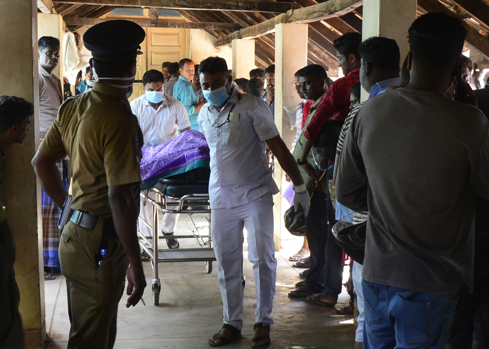 Sri Lankan hospital workers transport a body on a trolley at a hospital morgue following an explosion at a church in Batticaloa in eastern Sri Lanka April 21, 2019. u00e2u20acu201d AFP pic