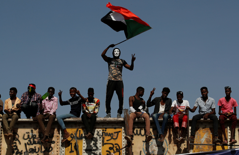 A Sudanese protester wearing a Guy Fawkes mask waves a national flag outside the defence ministry compound in Khartoum, Sudan, April 24, 2019. u00e2u20acu201d Reuters pic 