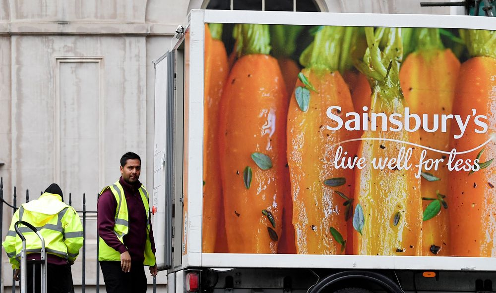 Workers unload a Sainsburyu00e2u20acu2122s home delivery van in central London, Britain, April 30, 2018. u00e2u20acu201d Reuters pic