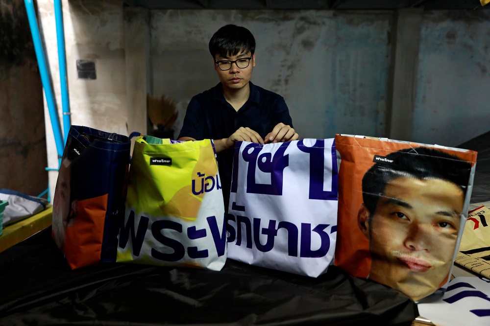 Fashion designer Panupong Chansopa displays tote bags made from old election campaign posters in his home in Bangkok April 8, 2019. u00e2u20acu201d Reuters pic     