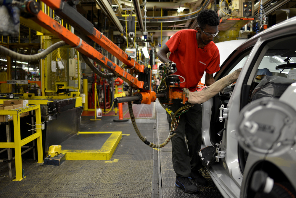 A line worker installs the front seats on the flex line at Nissan Motor Cou00e2u20acu2122s automobile manufacturing plant in Smyrna, Tennessee, US, August 23, 2018. u00e2u20acu201d Reuters pic 