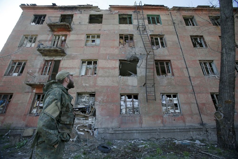 A Ukrainian serviceman walks past a building destroyed as a result of shelling by Russia-backed separatists in the small town of Zolote, in the Lugansk region, Ukraine on April 20, 2019. u00e2u20acu201d AFP pic