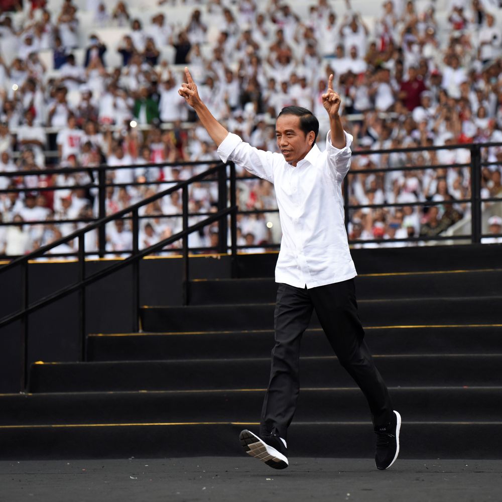Indonesiau00e2u20acu2122s incumbent presidential candidate Joko Widodo runs as he arrives during a campaign rally at Gelora Bung Karno stadium in Jakarta, Indonesia, April 13, 2019. u00e2u20acu201d Antara Foto/Ismar Patrizki/ via Reuters