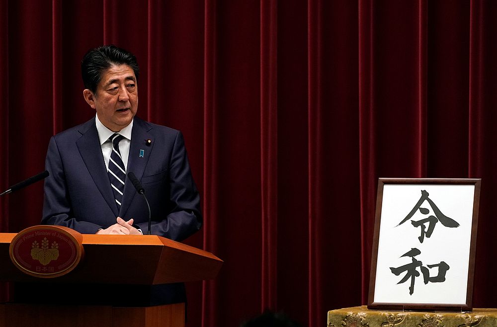 Japan's Prime Minister Shinzo Abe at a press conference standing next to the calligraphy 'Reiwa' which was chosen as the new era name at the prime minister's office in Tokyo April 1, 2019. u00e2u20acu201d Reuters pic