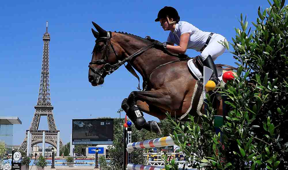 Athina Onassis of Greece riding MHS Going Global clears a hurdle in the Paris 1.45/1.50-metre jumping competition during the Longines Paris Eiffel 2018 on July 6, 2018. u00e2u20acu201d Reuters pic