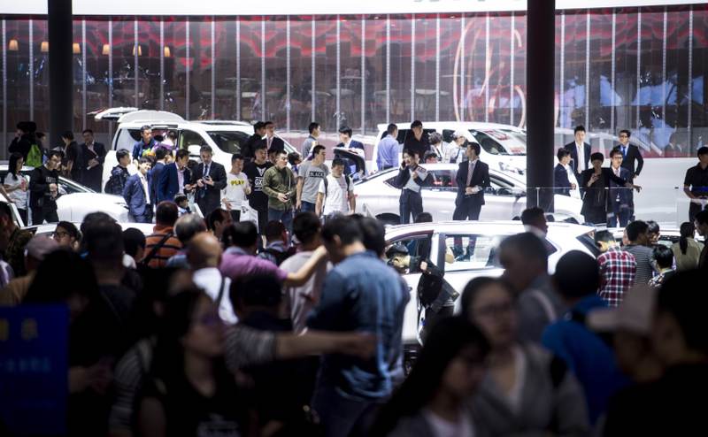 Visitors browse the cars on display at 2017 Auto Shanghai. u00e2u20acu2022 AFP pic