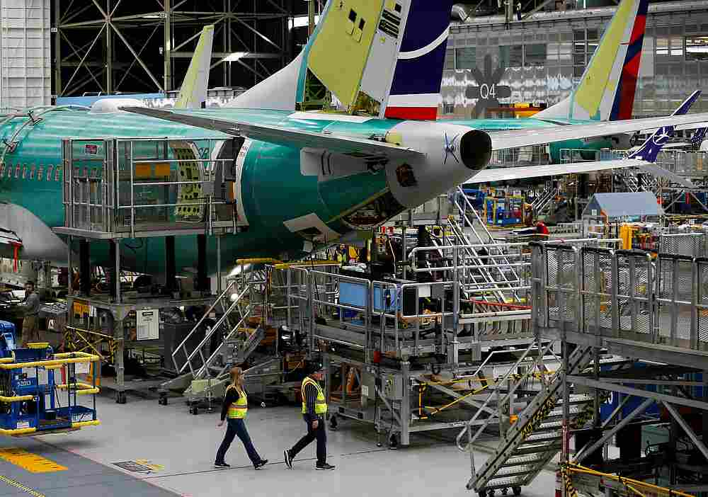 Employees walk by the end of a 737 MAX aircraft at the Boeing factory in Renton, Washington March 27, 2019. u00e2u20acu201d Reuters pic