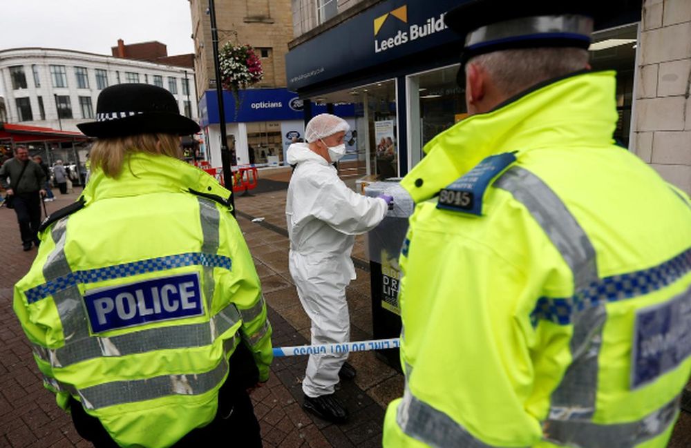 A police officer searches an area in the town centre after reports of a stabbing in Barnsley, Britain, September 8, 2018. u00e2u20acu201d Reuters pic