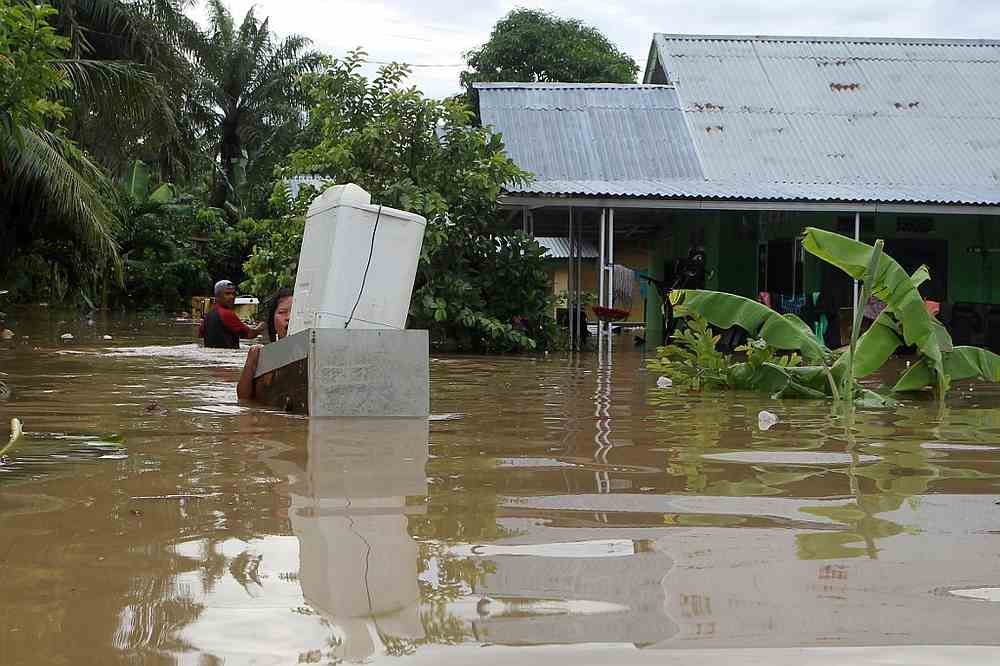 Residents salvaging belongings as floodwaters submerged their homes after heavy rains in Bengkulu on the Indonesian island of Sumatra April 27, 2019. u00e2u20acu201d AFP pic