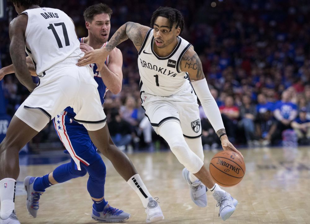 Brooklyn Nets guard D’Angelo Russell (1) dribbles past Philadelphia 76ers guard TJ McConnell (12) during the fourth quarter in game one of the first round of the 2019 NBA Playoffs at Wells Fargo Centre. — Reuters pic