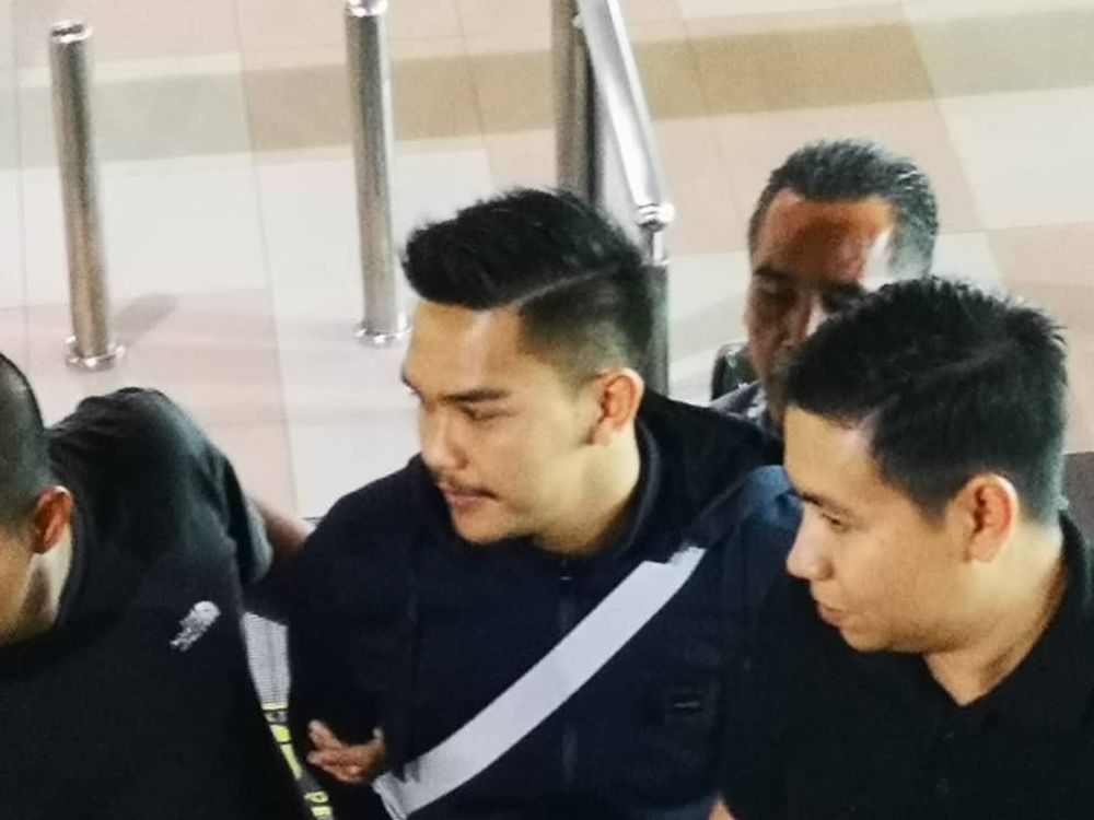 The 26-year old man, the sixth suspect in the Cambodian job scam, was arrested at the Kuching International Airport yesterday. u00e2u20acu2022 Picture courtesy of the Sarawak Commercial Crimes Investigation Department 