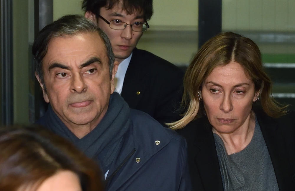 This picture taken April 3, 2019 shows former Nissan Chairman Carlos Ghosn and his wife Carole leave the office of his lawyer Junichiro Hironaka in Tokyo. u00e2u20acu201d AFP pic 