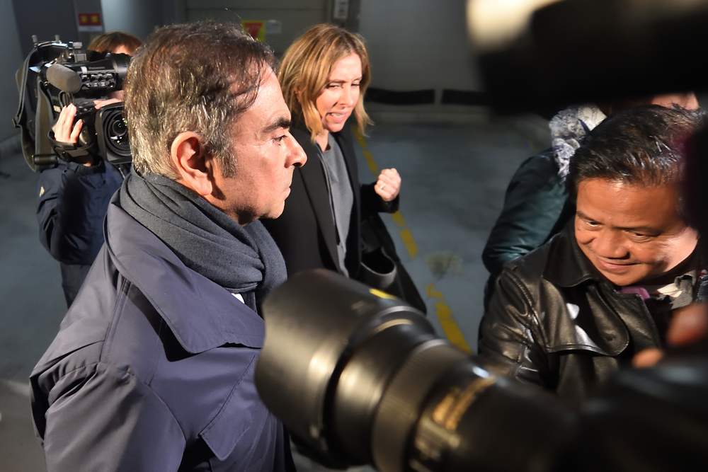 Former Nissan chairman Carlos Ghosn (left) and his wife Carole leave the office of his lawyer Junichiro Hironaka in Tokyo April 3, 2019. u00e2u20acu201d AFP pic