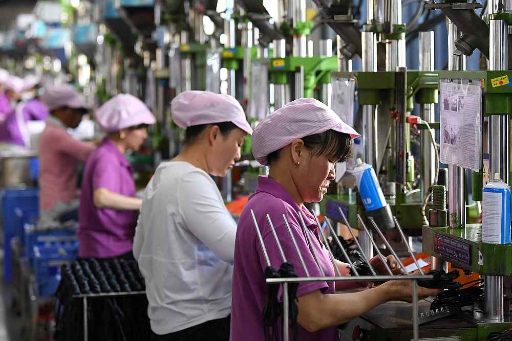 Women work on a data cable production line at a factory in Xinyu, Jiangxi province China April 8, 2019. u00e2u20acu201d Reuters pic