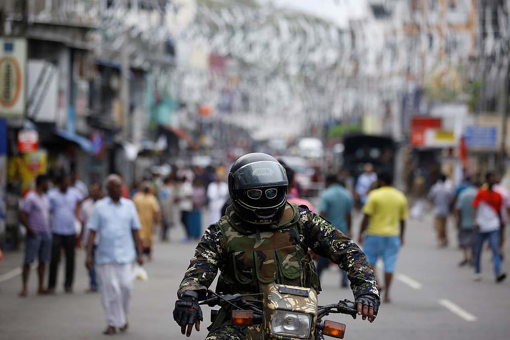 A member of the Sri Lankan security forces sits on a motorbike as he keeps watch outside St Anthony's Shrine in Colombo April 28, 2019. u00e2u20acu201d Reuters pic