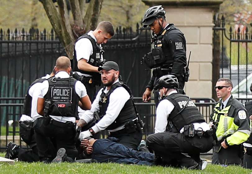 Police and rescue personnel tend to a man in Lafayette Park after the man lit his jacket on fire in front of the White House in Washington April 12, 2019. u00e2u20acu201d Reuters pic 