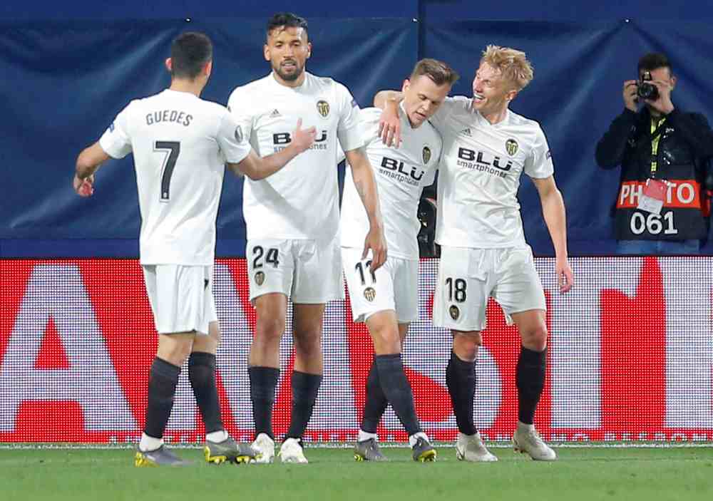 Valencia's Daniel Wass celebrates with team mates after scoring the second goal against Villareal, April 11, 2019. u00e2u20acu2022 Reuters pic