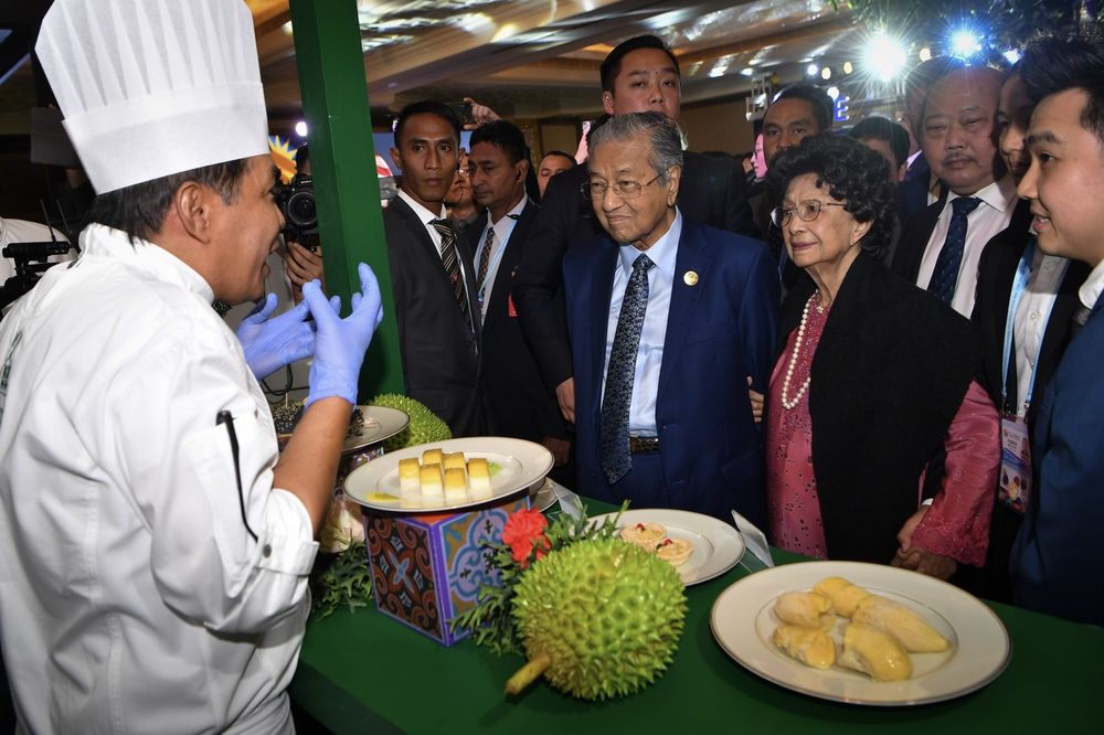 Prime Minister Tun Dr Mahathir Mohamad (centre) and wife Tun Dr Siti Hasmah Mohd Ali visiting the Malaysia Durian Festival exhibition booth in Beijing, April 27, 2019. u00e2u20acu201d Bernama pic