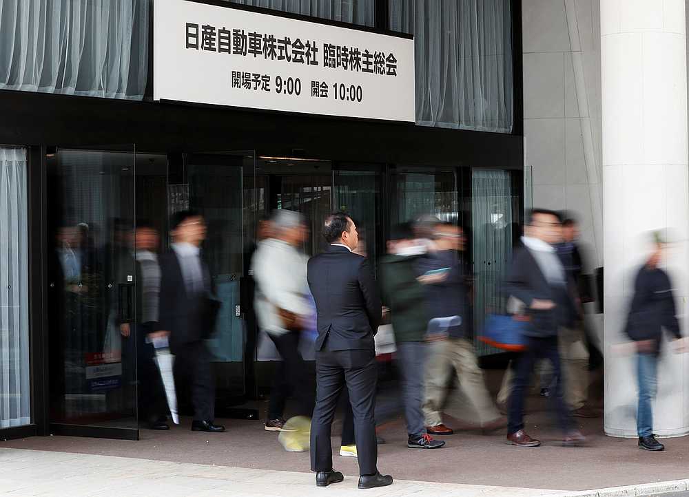 Shareholders walk at a venue for the extraordinary shareholders meeting of Nissan Motor Co in Tokyo, Japan April 8, 2019. u00e2u20acu201d Reuters pic