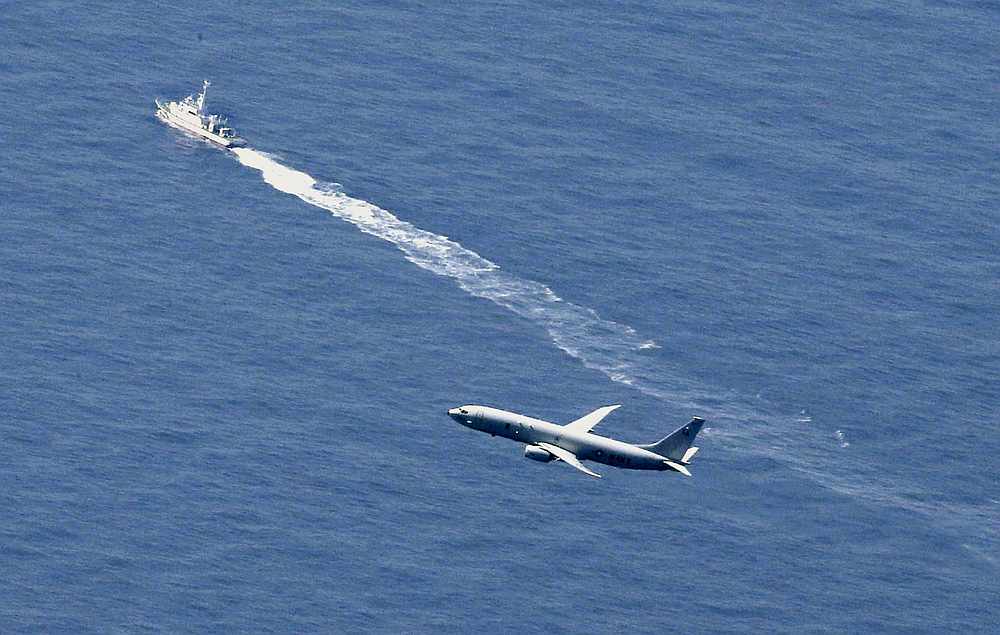 A Japan Coast Guard vessel and US military aircraft conduct rescue and search operations at the site where an Air Self-Defence Force's F-35A stealth fighter jet crashed in Japan April 9, 2019. u00e2u20acu201d Kyodo pic via Reuters