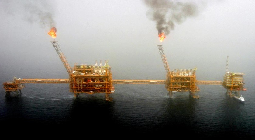 Gas flares from an oil production platform at the Soroush oil fields in the Persian Gulf, south of the capital Tehran, July 25, 2005. u00e2u20acu201d Reuters pic 