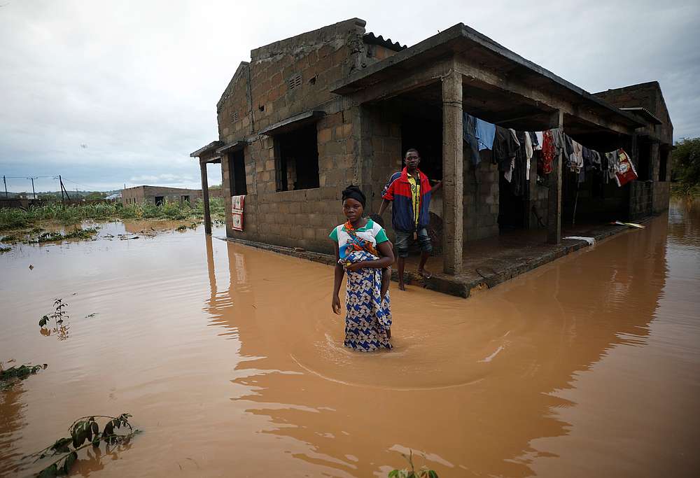 Agiro Cavanda and his wife Agera wade through floodwaters outside their home, flooded in the aftermath of Cyclone Kenneth, at Wimbe village in Pemba, Mozambique April 29, 2019. u00e2u20acu201d Reuters pic