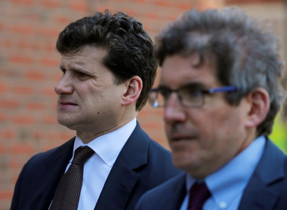 Gordon Caplan, (left) co-chairman of Willkie Farr and Gallagher law company, facing charges in a nationwide college admissions cheating scheme, enters federal court in Boston, Massachusetts, US, April 3, 2019. u00e2u20acu201d Reuters pic