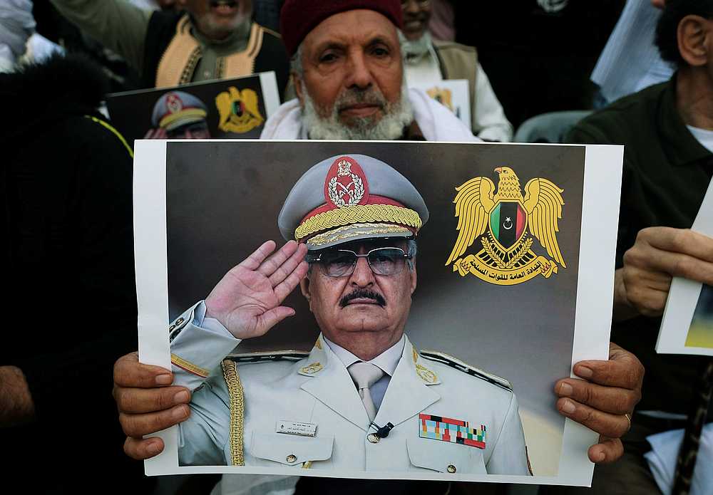 A Libyan man carries a picture of Khalifa Haftar during a demonstration to support Libyan National Army offensive against Tripoli, in Benghazi, Libya April 12, 2019. u00e2u20acu201d Reuters pic