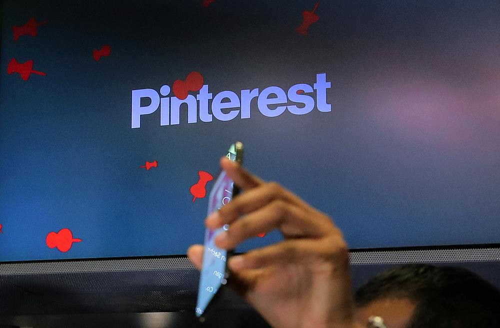 A guest hold up a phone during the Pinterest Inc IPO on the floor of the New York Stock Exchange April 18, 2019. u00e2u20acu201d Reuters pic