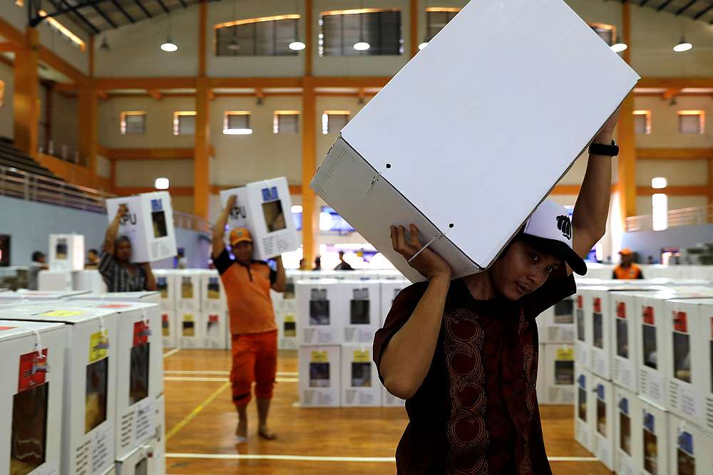 Workers carry election materials to be distributed to polling stations from a warehouse in Jakarta, Indonesia April 16, 2019. u00e2u20acu201d Reuters pic