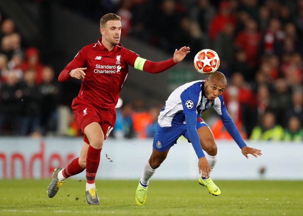 Liverpool's Jordan Henderson in action with FC Porto's Yacine Brahimi during the Champions League quarter final first leg at Anfield, April 9, 2019. u00e2u20acu2022 Reuters pic