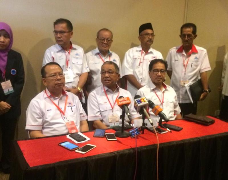 Datuk Seri Lajim Ukin (seated, centre) announced the dissolution of his two-year-old Parti Harapan Rakyat Sabah to pave the way for its membership of PPBM which launches in Sabah tomorrow. u00e2u20acu201d Picture by Julia Chan