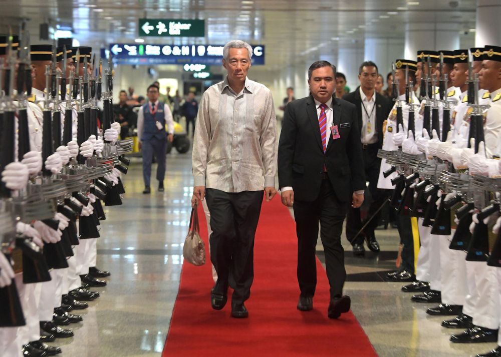 Singapore Prime Minister Lee Hsien Loong is greeted by Transport Minister Anthony Loke at the Kuala Lumpur International Airport in Sepang April 8, 2019. u00e2u20acu201d Bernama pic