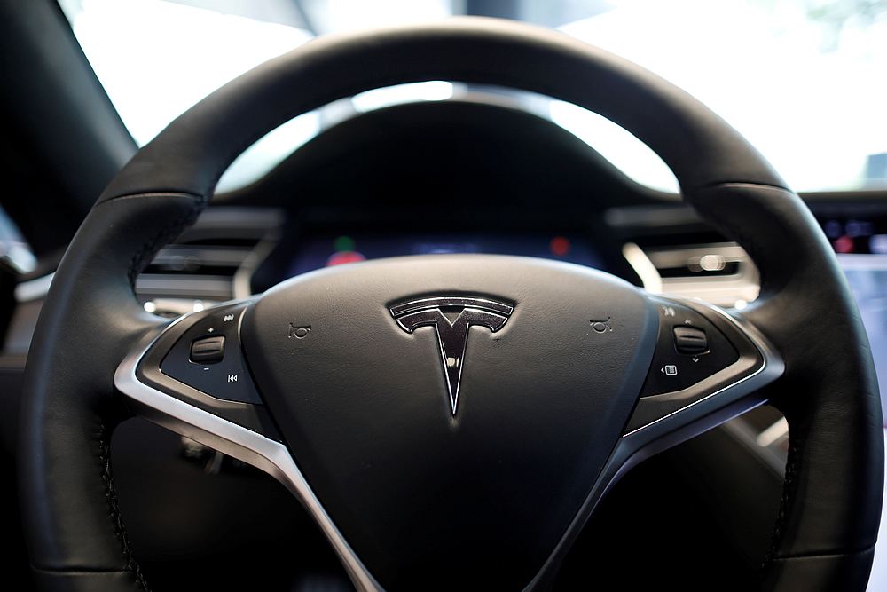 The logo of Tesla is seen on a steering wheel of its Model S electric car at its dealership in Seoul, South Korea July 6, 2017. u00e2u20acu201d Reuters pic